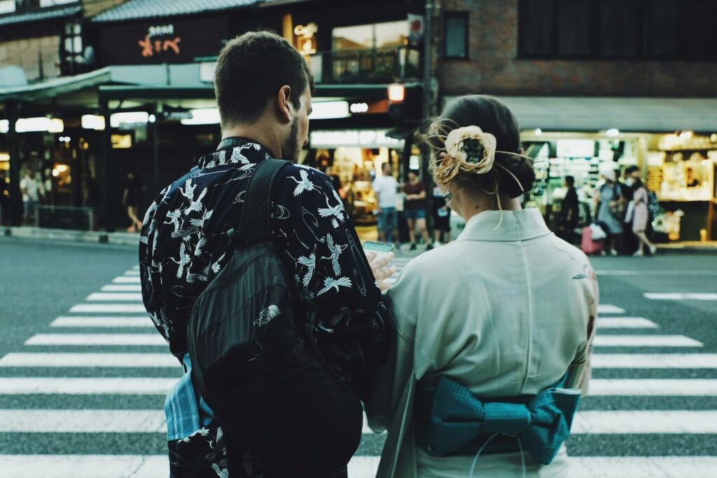 A couple that are dating in Japan. One is a foreigner and the other is Japanese.