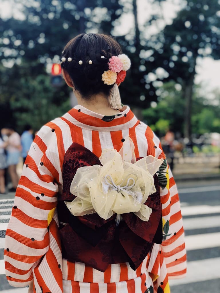 Japanese women wearing a stripped Yukata. Traditional Japanese Clothes.